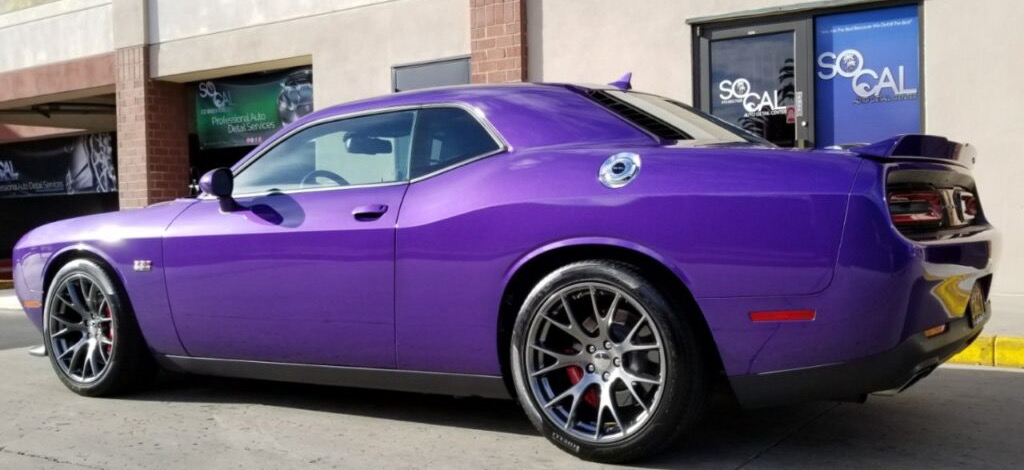 Plum Crazy Dodge Challenger freshly detailed outside SoCal Auto Detail Center