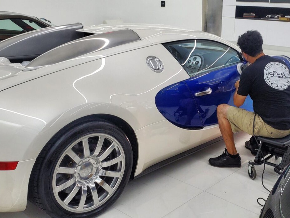 Bugatti Veyron being machine polished